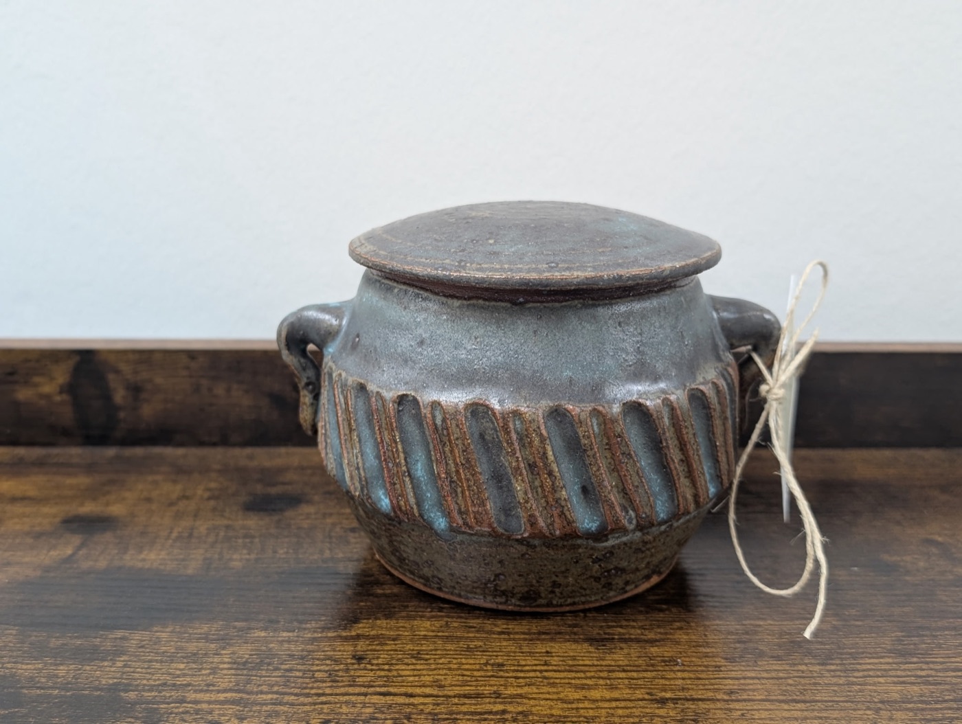 Handmade stoneware lidded crock with vertical ribbing and two side handles