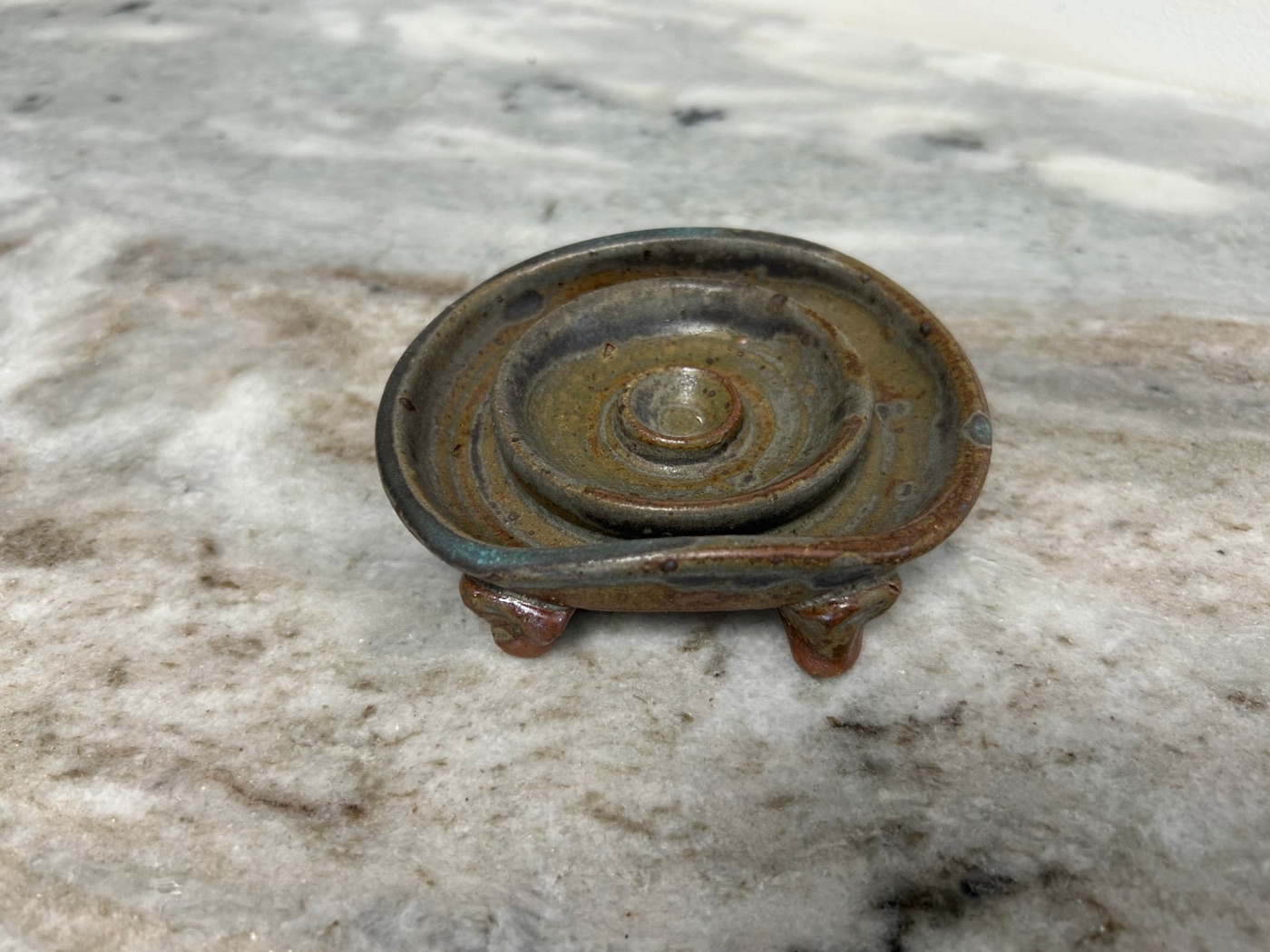 Handmade pottery soap dish with concentric drain rings and three little feet, rust and slate glaze