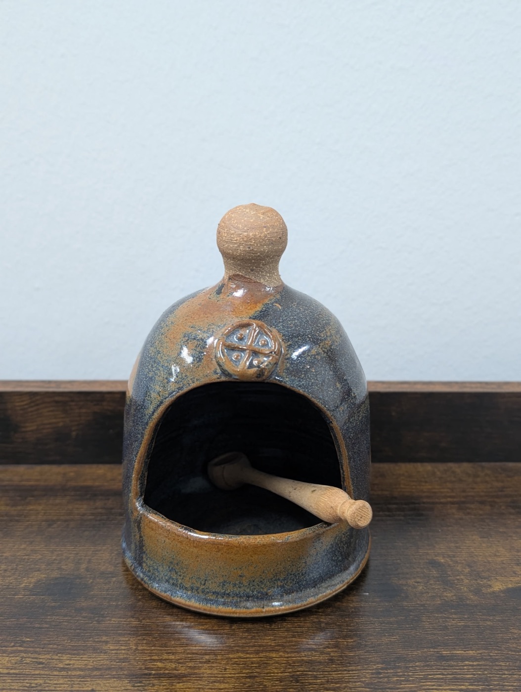 Handmade pottery salt cellar with domed lid and wooden scoop, blue and rust glaze