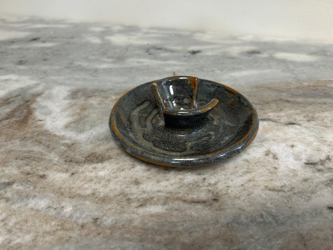 Handmade dark slate blue pottery soap dish with a raised central soap stand